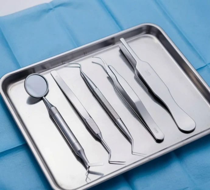 Basic dental examination instrument set including mouth mirrors, probes, explorers, tweezers, and spatulas for routine clinical procedures